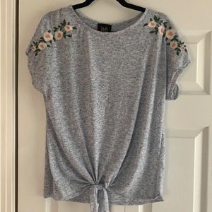 Light blue tee with floral detail
